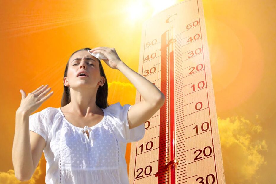 Germania se află în mijlocul unui val de căldură mortal. În imagine, o femeie pe fondul unui termometru care indică temperaturi ridicate și un soare arzător