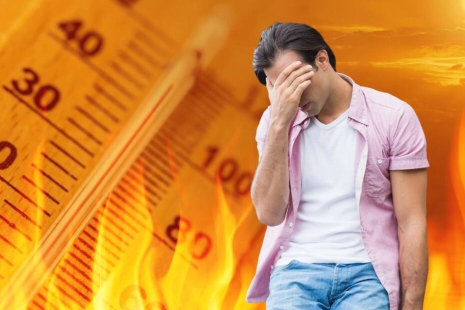 Peste 5.000 de decese provocate de căldură în Germania. În imagine, o persoană care se simte rău pe fondul unui termometru în flăcări