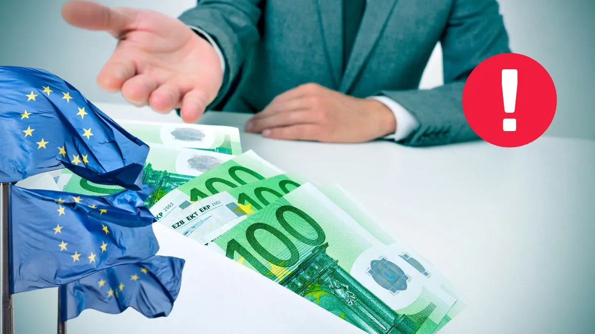Noi reguli pentru plățile în numerar în UE. Imagine ilustrativă cu opersoană întinzând mâna și o suma de bani în plic, cu steagurile europene lateral